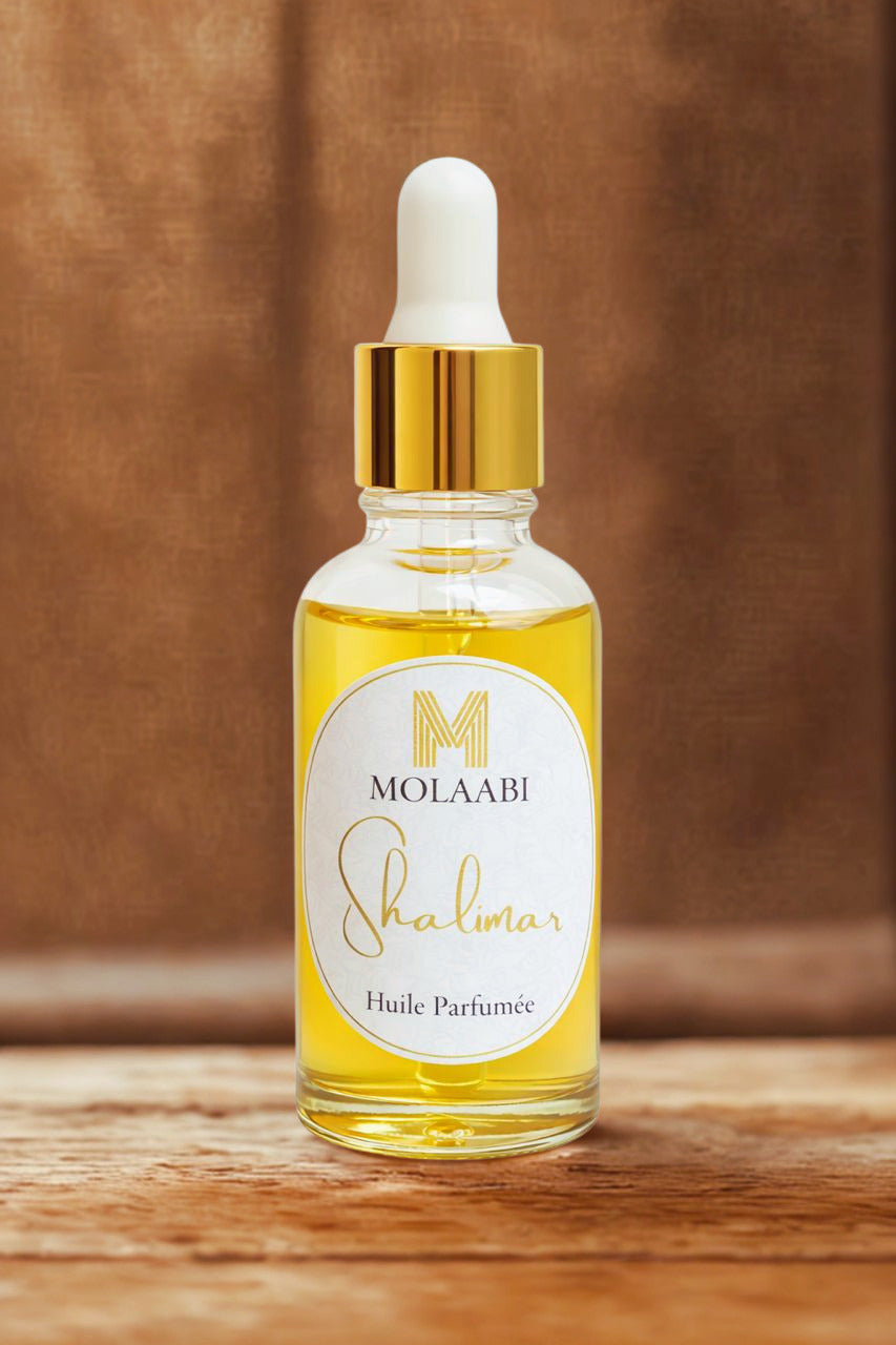 Huile parfumée Shalimar Molaabi — Rituel beauté africain 
flacon pipette doré Sénégal
